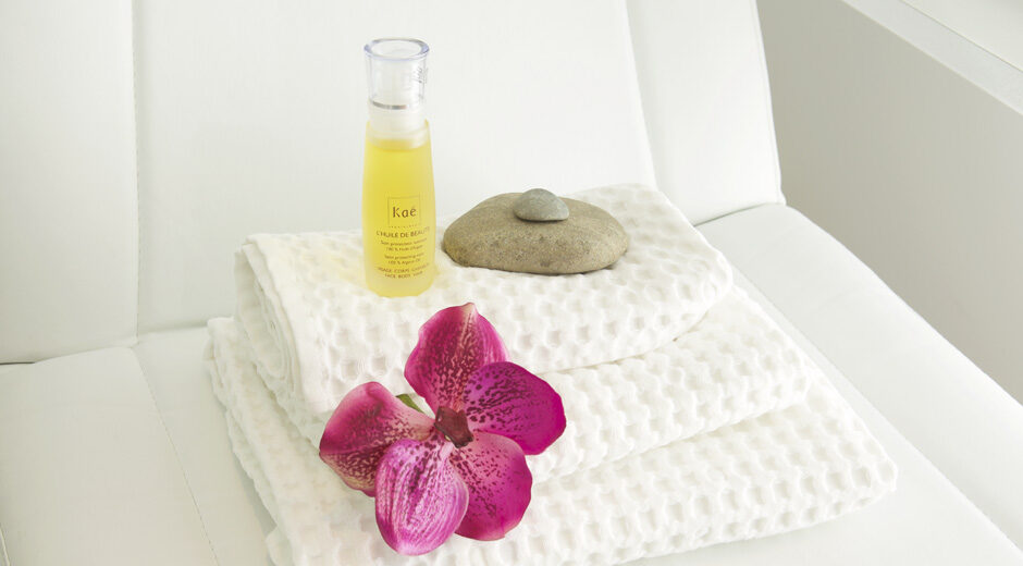 Wafelhanddoeken met arganolie, massagesteen en orchidee